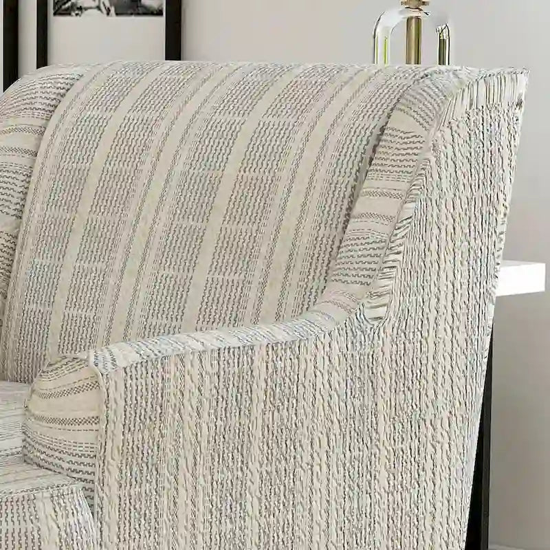 Fauteuil de transition en chenille rayée, pieds en bois fuselés, coussin d'assise en T